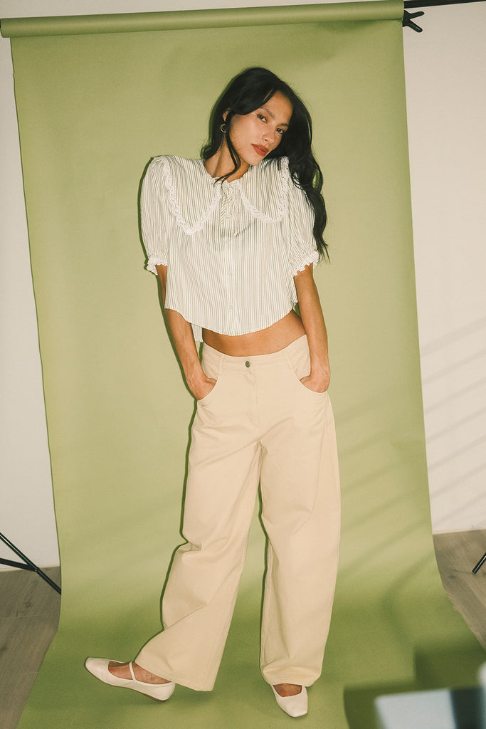 a vintage-inspired puff sleeve top with a pastel green pinstripe pattern + an oversized lace trim collar. the perfect elevated button up top for the office, dressy date nights, + everyday wear.