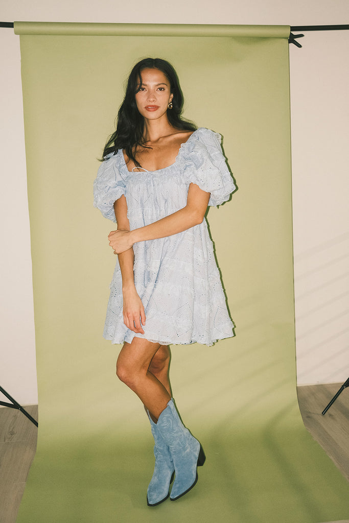 a blue puff sleeve mini dress with lace tiered details + a stretchy square neckline. perfect for family pictures, baby showers, weddings, + special occasions.