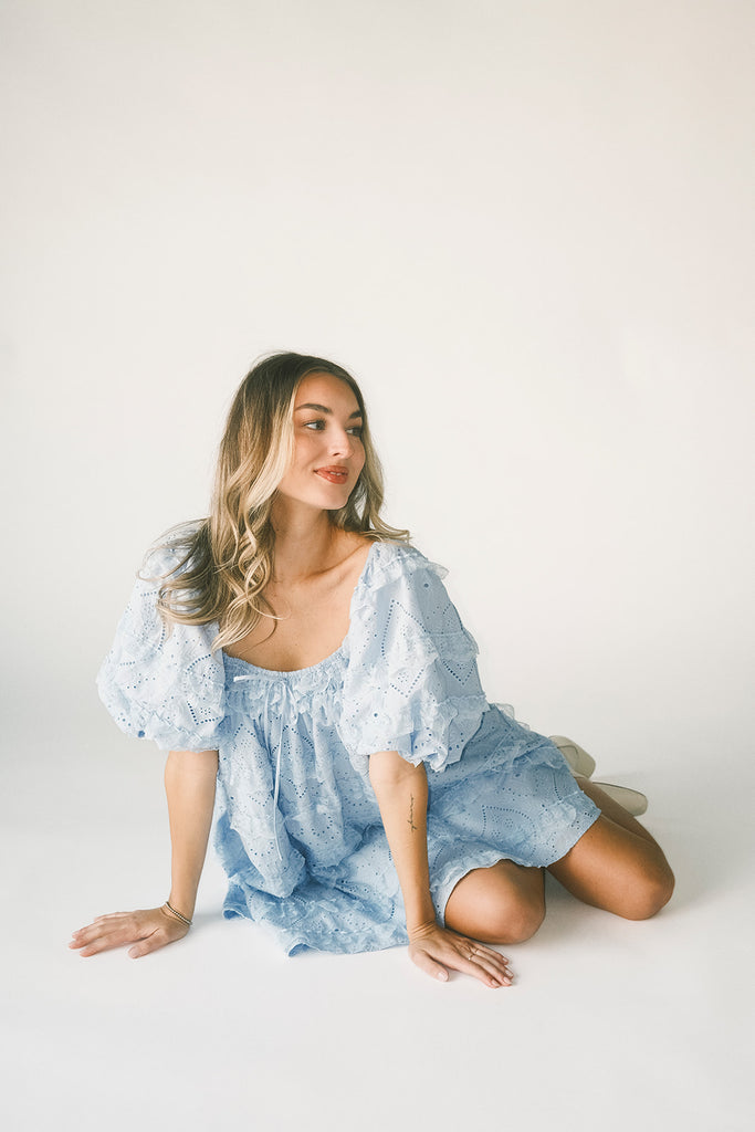 a blue puff sleeve mini dress with lace tiered details + a stretchy square neckline. perfect for family pictures, baby showers, weddings, + special occasions.