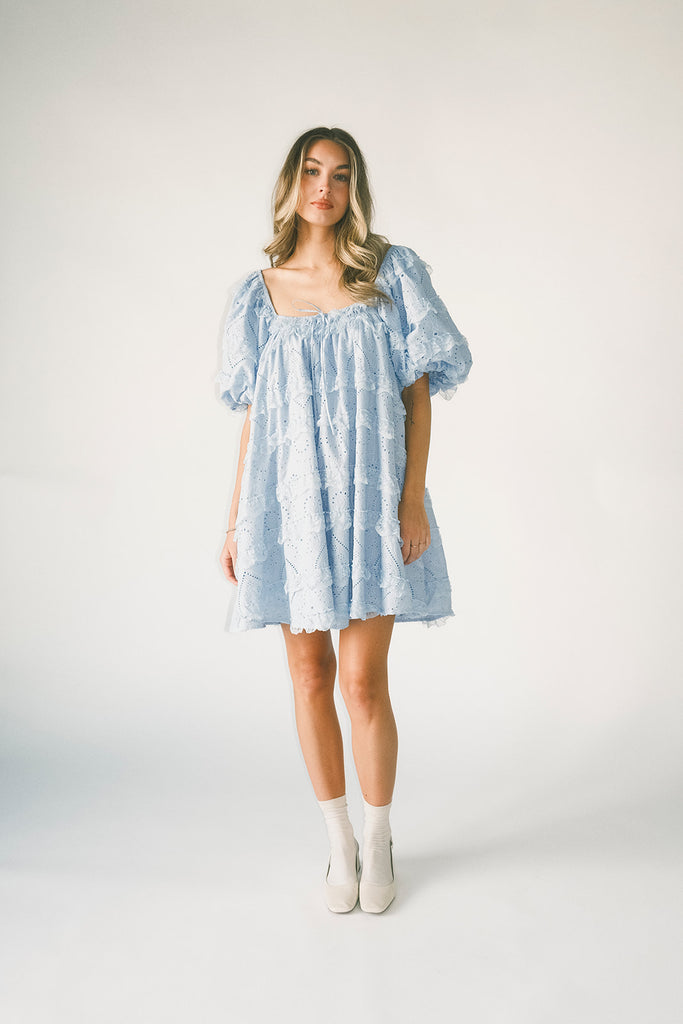 a blue puff sleeve mini dress with lace tiered details + a stretchy square neckline. perfect for family pictures, baby showers, weddings, + special occasions.