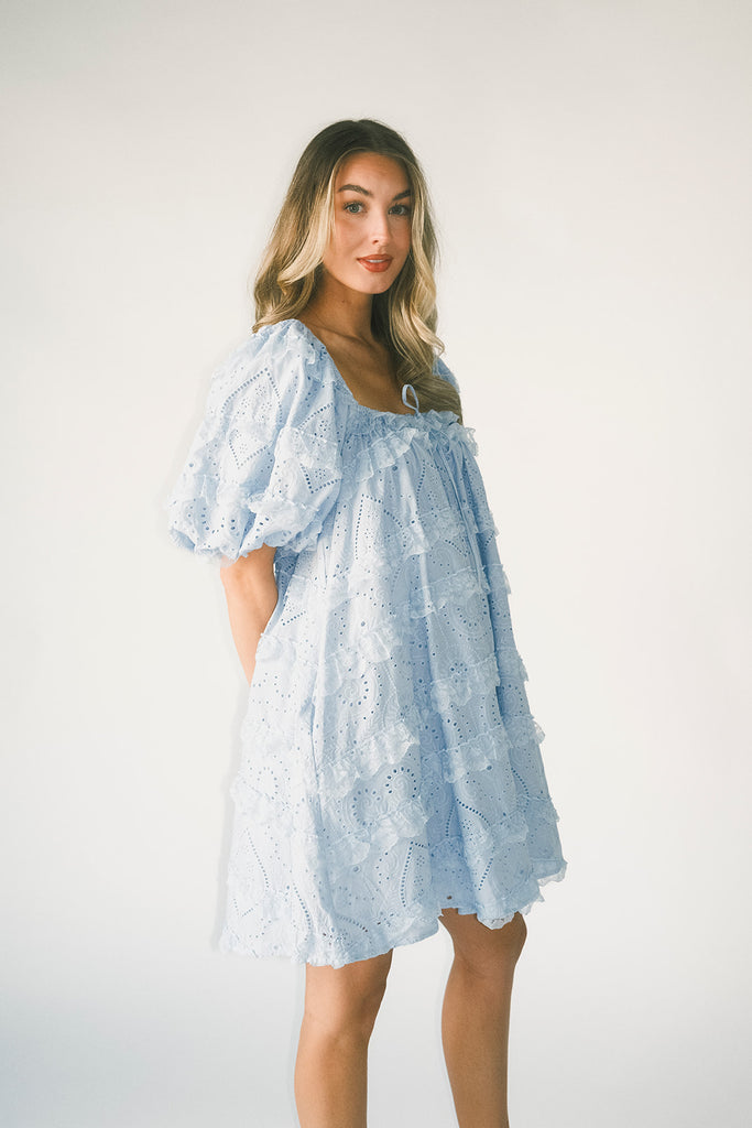 a blue puff sleeve mini dress with lace tiered details + a stretchy square neckline. perfect for family pictures, baby showers, weddings, + special occasions.