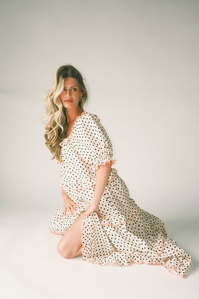zoco daymaker dress: puff sleeve polka dot dress with an elastic neckline and pink trim details. perfect for weddings, baby showers, and family pictures.