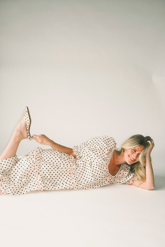 zoco daymaker dress: puff sleeve polka dot dress with an elastic neckline and pink trim details. perfect for weddings, baby showers, and family pictures.