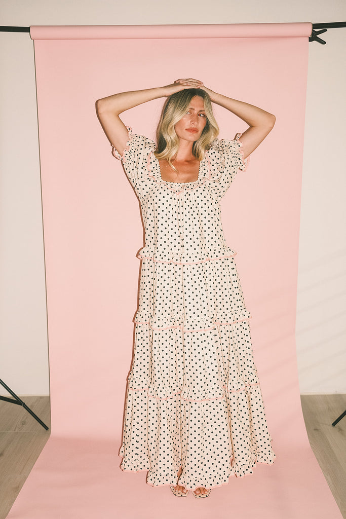 zoco daymaker dress: puff sleeve polka dot dress with an elastic neckline and pink trim details. perfect for weddings, baby showers, and family pictures.