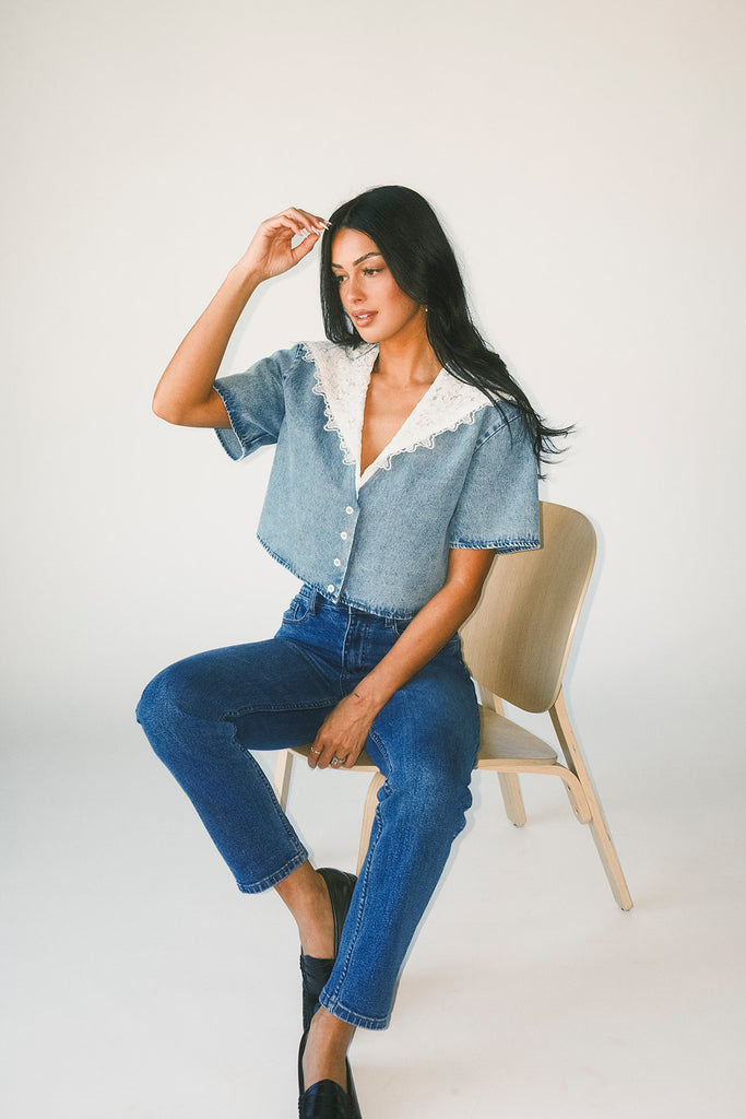 a short sleeve denim top with an oversized lace collar + a cropped silhouette. the perfect button up denim top to dress up or down for any outfit idea.