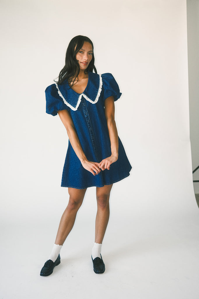 a puff sleeve denim dress with a lace trimmed collar detail. the perfect denim mini dress for date nights, family pictures, + everyday wear.