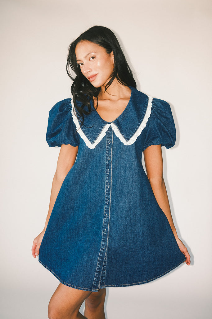 a puff sleeve denim dress with a lace trimmed collar detail. the perfect denim mini dress for date nights, family pictures, + everyday wear.