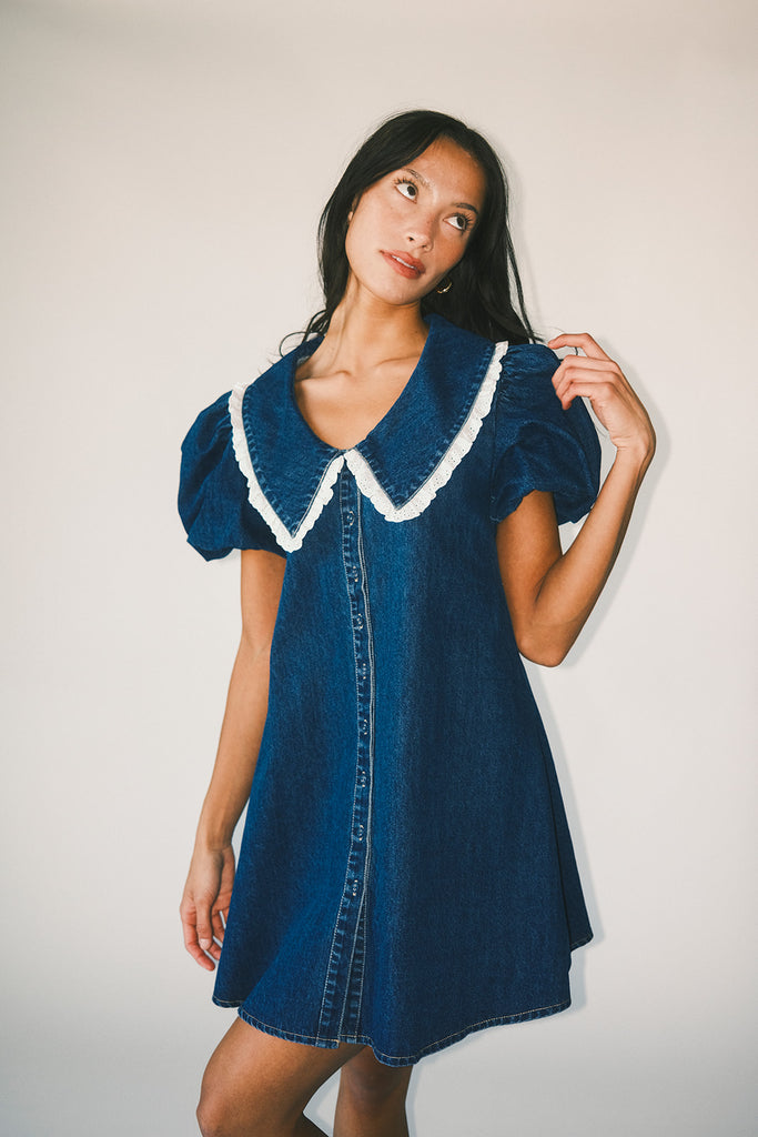 a puff sleeve denim dress with a lace trimmed collar detail. the perfect denim mini dress for date nights, family pictures, + everyday wear.