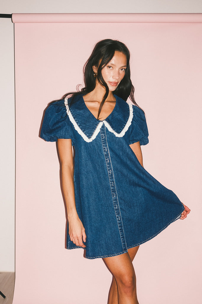 a puff sleeve denim dress with a lace trimmed collar detail. the perfect denim mini dress for date nights, family pictures, + everyday wear.