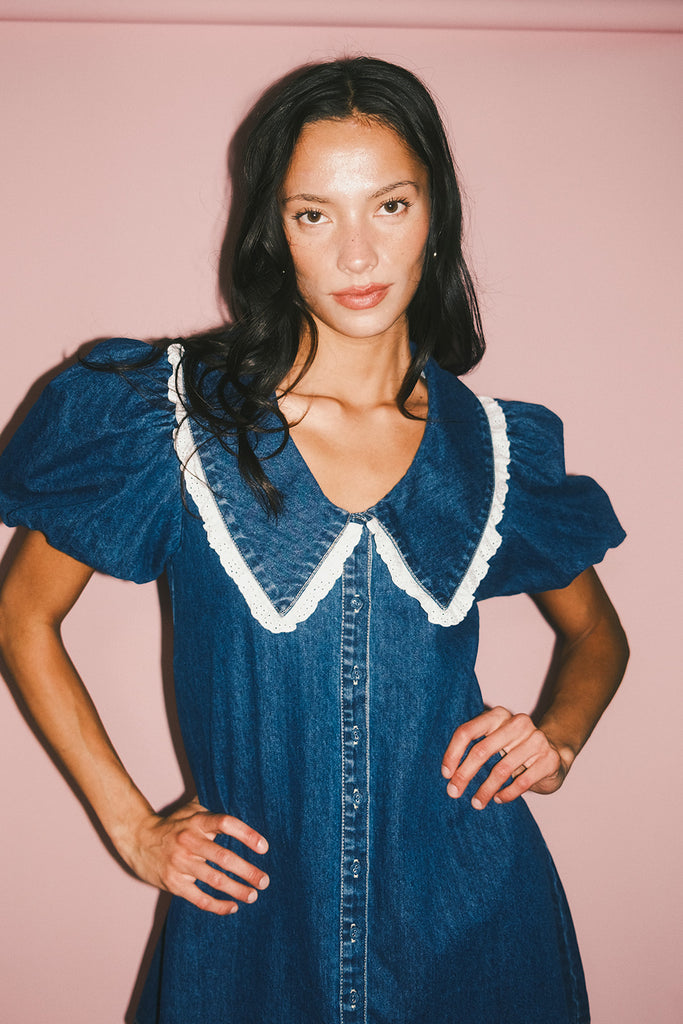 a puff sleeve denim dress with a lace trimmed collar detail. the perfect denim mini dress for date nights, family pictures, + everyday wear.