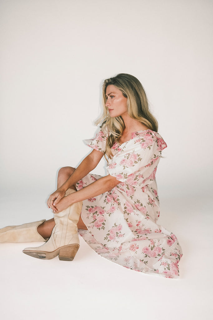 a pink floral puff sleeve dress with a ruffle neckline. the perfect vintage-inspired dress for baby showers, family pictures, + special occasions.