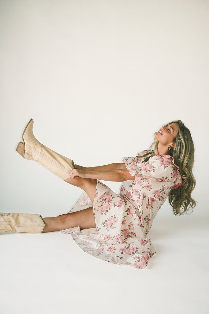 a pink floral puff sleeve dress with a ruffle neckline. the perfect vintage-inspired dress for baby showers, family pictures, + special occasions.