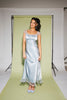 a light blue silk midi dress with lace detailing + a fitted silhouette. the perfect short sleeve occasion dress for weddings, bridal showers, + dinner parties.
