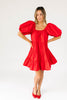 zoco daymaker dress: a short puff sleeve dress with an elastic neckline. the perfect red cotton dress for family pictures, weddings, and baby showers.

