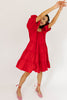 zoco daymaker dress: a short puff sleeve dress with an elastic neckline. the perfect red cotton dress for family pictures, weddings, and baby showers.
