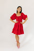 zoco daymaker dress: a short puff sleeve dress with an elastic neckline. the perfect red cotton dress for family pictures, weddings, and baby showers.
