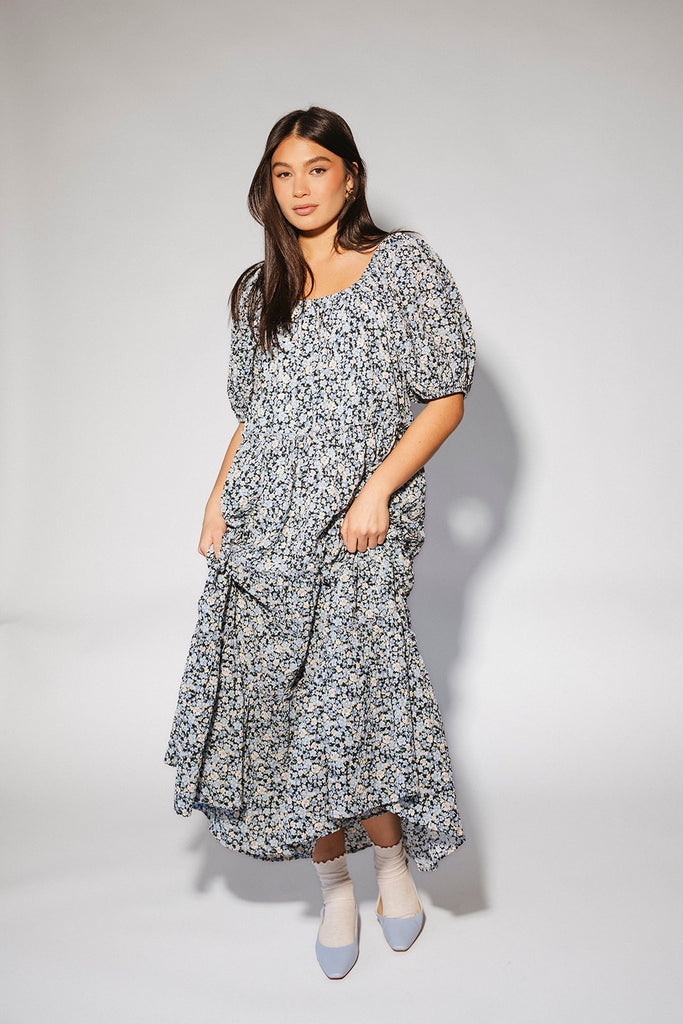 puff sleeve blue floral maxi dress with an elastic neckline. perfect for weddings, baby showers, and family pictures.