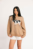 crewneck cow sweater with a relaxed fit. the perfect neutral cow detail sweater for spring outfits and lightweight layering. 
