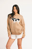 crewneck cow sweater with a relaxed fit. the perfect neutral cow detail sweater for spring outfits and lightweight layering. 
