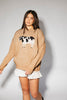 crewneck cow sweater with a relaxed fit. the perfect neutral cow detail sweater for spring outfits and lightweight layering. 
