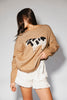 crewneck cow sweater with a relaxed fit. the perfect neutral cow detail sweater for spring outfits and lightweight layering. 
