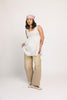 a white tank with a babydoll style silhouette + eyelet details. pair it with the matching white shorts to create the perfect two piece set for brunch dates, vacations, + everyday wear. 