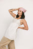 a white tank with a babydoll style silhouette + eyelet details. pair it with the matching white shorts to create the perfect two piece set for brunch dates, vacations, + everyday wear. 