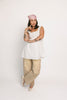 a white tank with a babydoll style silhouette + eyelet details. pair it with the matching white shorts to create the perfect two piece set for brunch dates, vacations, + everyday wear. 