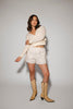 white cotton shorts with eyelet details. pair them with the matching white tank top to create the perfect two piece set for brunch dates, vacations, + everyday wear. 