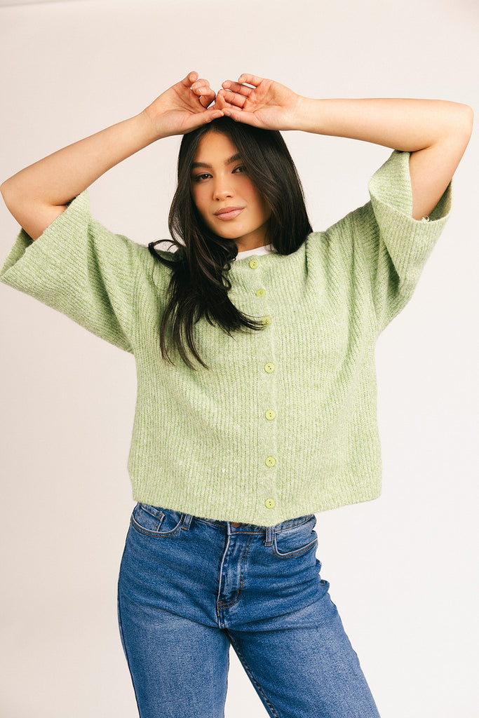 light green short sleeve cardigan with a slouchy, relaxed fit. perfect for casual outfits + lightweight layering.
