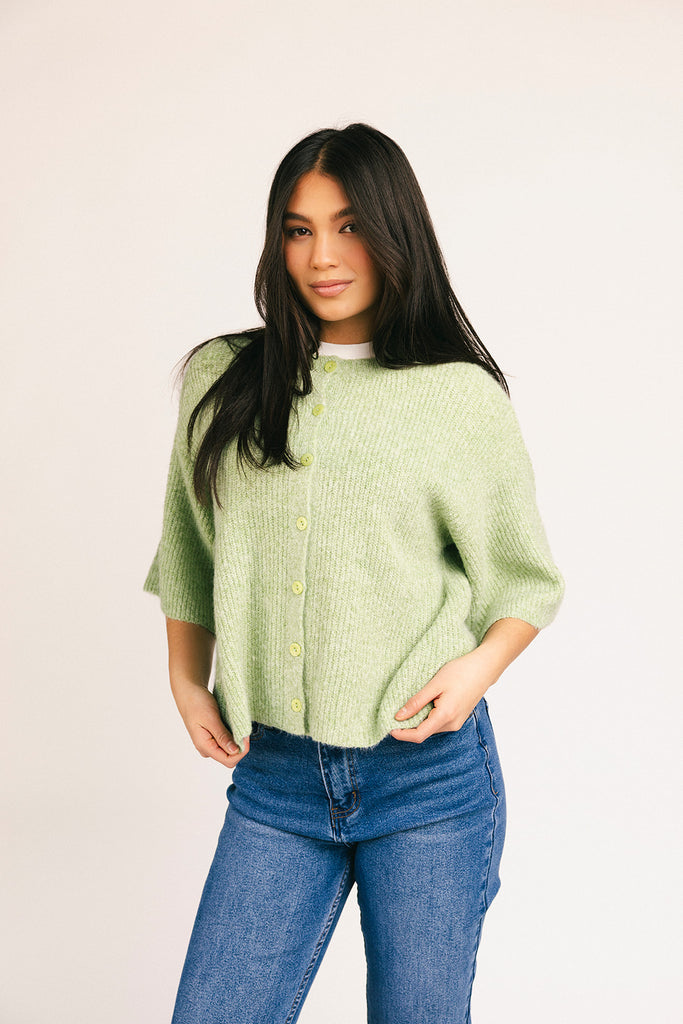 light green short sleeve cardigan with a slouchy, relaxed fit. perfect for casual outfits + lightweight layering.

