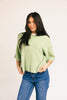 light green short sleeve cardigan with a slouchy, relaxed fit. perfect for casual outfits + lightweight layering.
