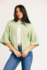 light green short sleeve cardigan with a slouchy, relaxed fit. perfect for casual outfits + lightweight layering.
