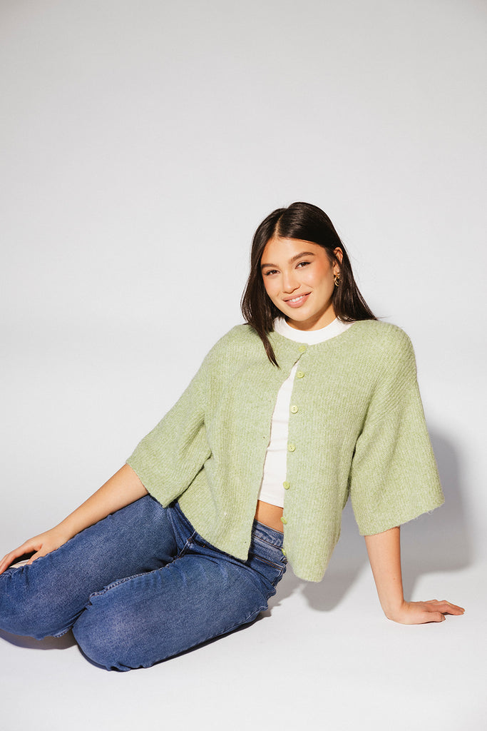 light green short sleeve cardigan with a slouchy, relaxed fit. perfect for casual outfits + lightweight layering.
