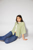 light green short sleeve cardigan with a slouchy, relaxed fit. perfect for casual outfits + lightweight layering.
