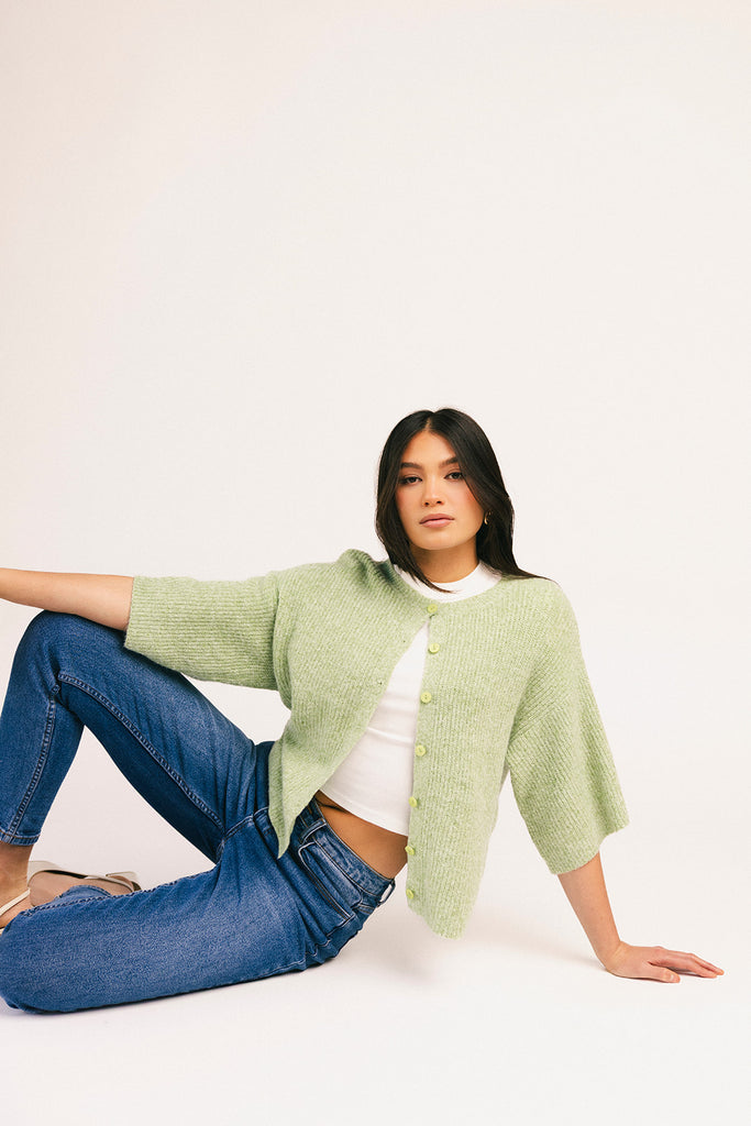 light green short sleeve cardigan with a slouchy, relaxed fit. perfect for casual outfits + lightweight layering.
