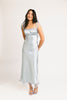 a light blue silk midi dress with lace detailing + a fitted silhouette. the perfect short sleeve occasion dress for weddings, bridal showers, + dinner parties.
