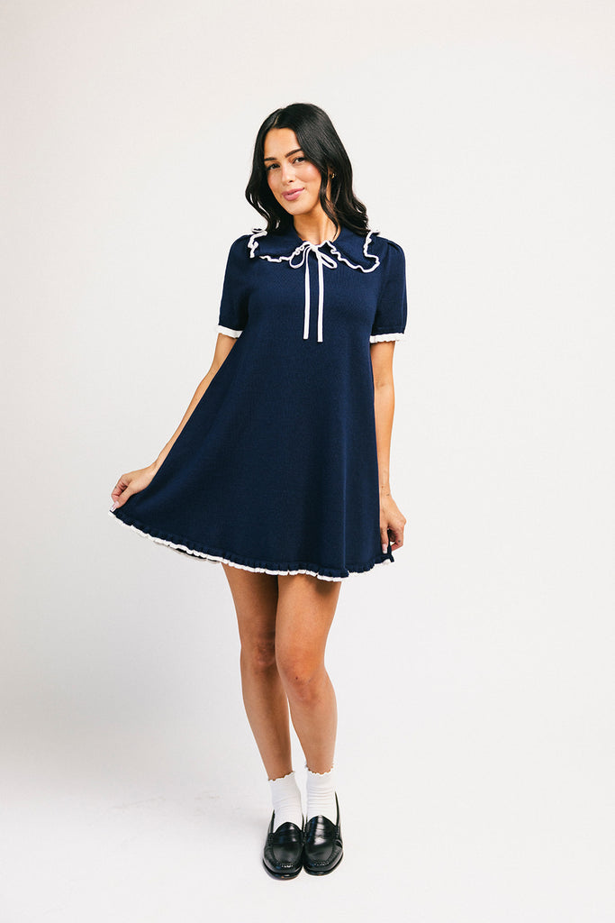 a short sleeve knit mini dress with a ruffled collar + bow detail. the perfect navy knit dress for date nights, family pictures, + everyday wear.
