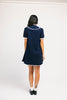 a short sleeve knit mini dress with a ruffled collar + bow detail. the perfect navy knit dress for date nights, family pictures, + everyday wear.
