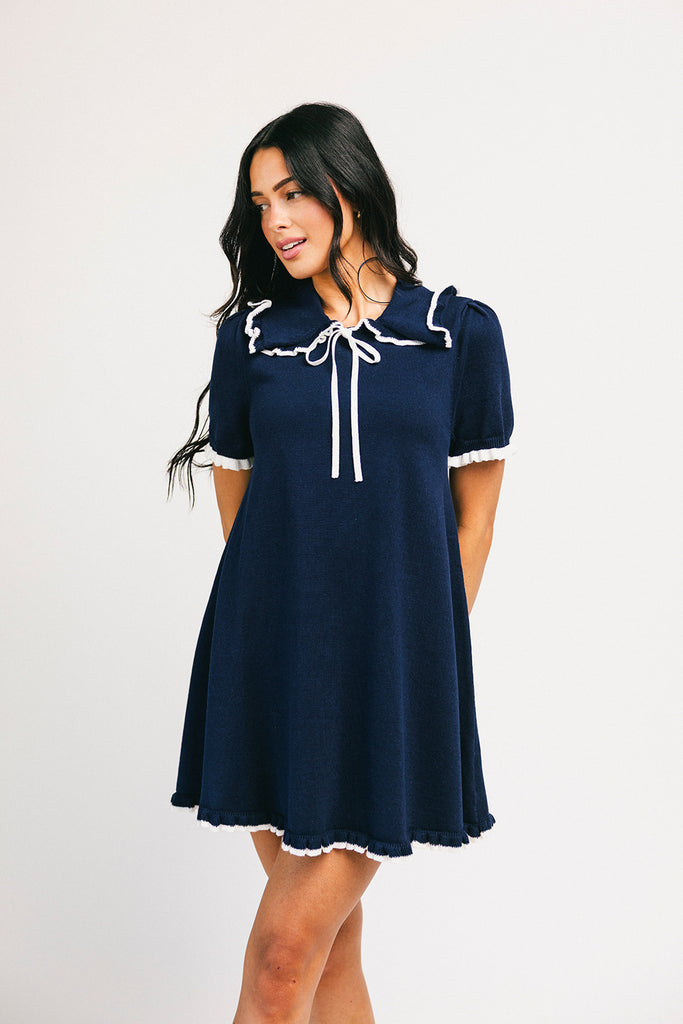 a short sleeve knit mini dress with a ruffled collar + bow detail. the perfect navy knit dress for date nights, family pictures, + everyday wear.
