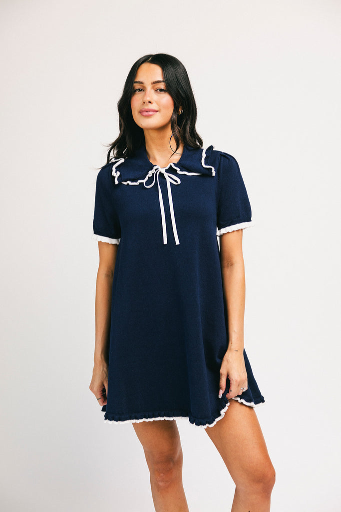 a short sleeve knit mini dress with a ruffled collar + bow detail. the perfect navy knit dress for date nights, family pictures, + everyday wear.

