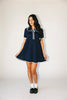 a short sleeve knit mini dress with a ruffled collar + bow detail. the perfect navy knit dress for date nights, family pictures, + everyday wear.
