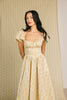 vintage-inspired puff sleeve dress with a muted yellow floral pattern. the perfect puff sleeve midi dress for weddings, bridal showers, + semi-formal events.