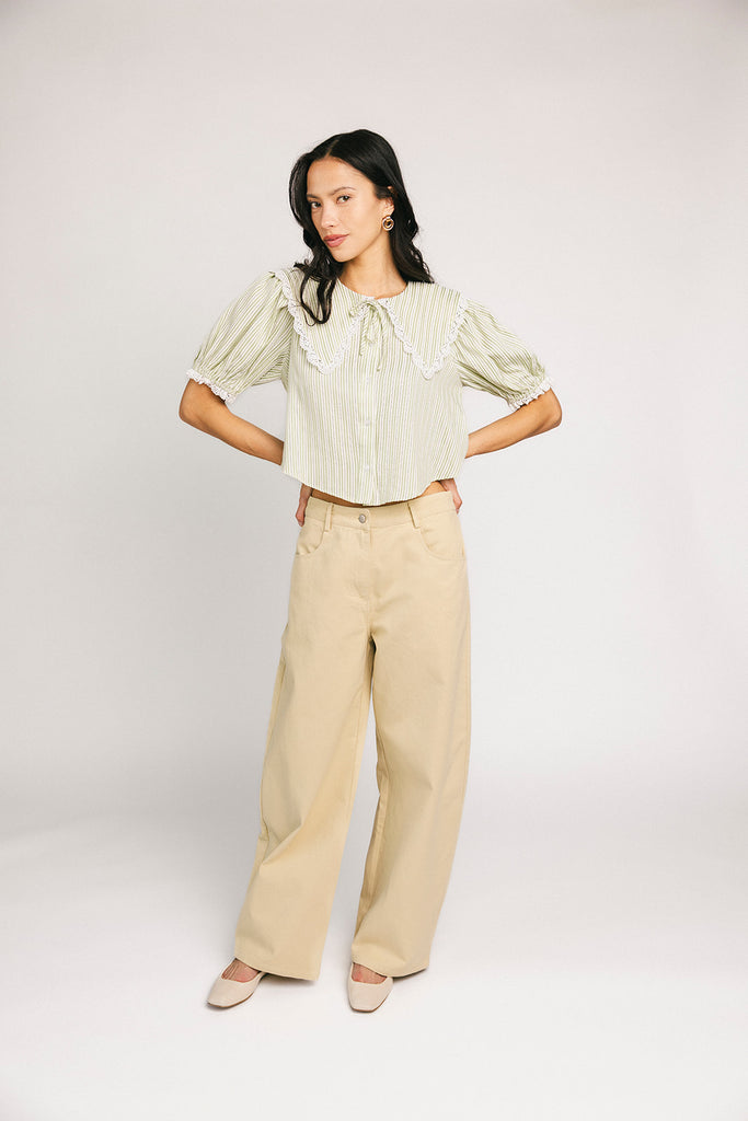 a vintage-inspired puff sleeve top with a pastel green pinstripe pattern + an oversized lace trim collar. the perfect elevated button up top for the office, dressy date nights, + everyday wear.
