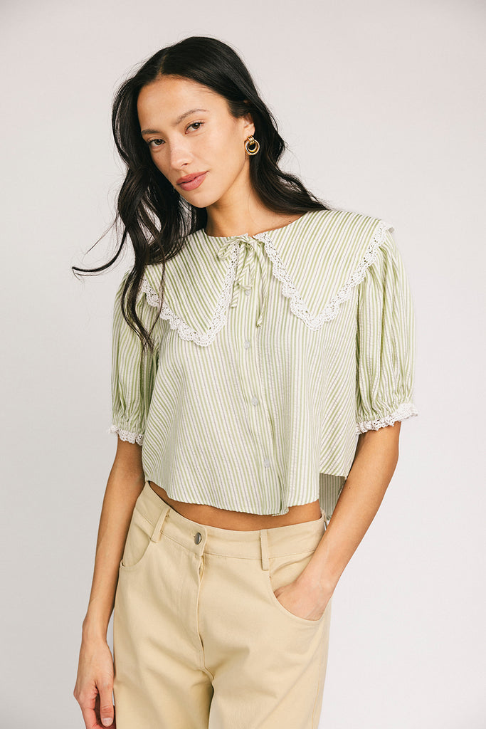 a vintage-inspired puff sleeve top with a pastel green pinstripe pattern + an oversized lace trim collar. the perfect elevated button up top for the office, dressy date nights, + everyday wear.
