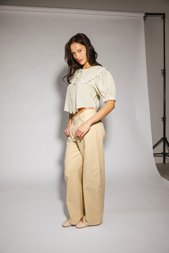 a vintage-inspired puff sleeve top with a pastel green pinstripe pattern + an oversized lace trim collar. the perfect elevated button up top for the office, dressy date nights, + everyday wear.
