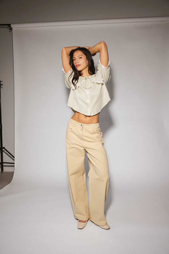 a vintage-inspired puff sleeve top with a pastel green pinstripe pattern + an oversized lace trim collar. the perfect elevated button up top for the office, dressy date nights, + everyday wear.
