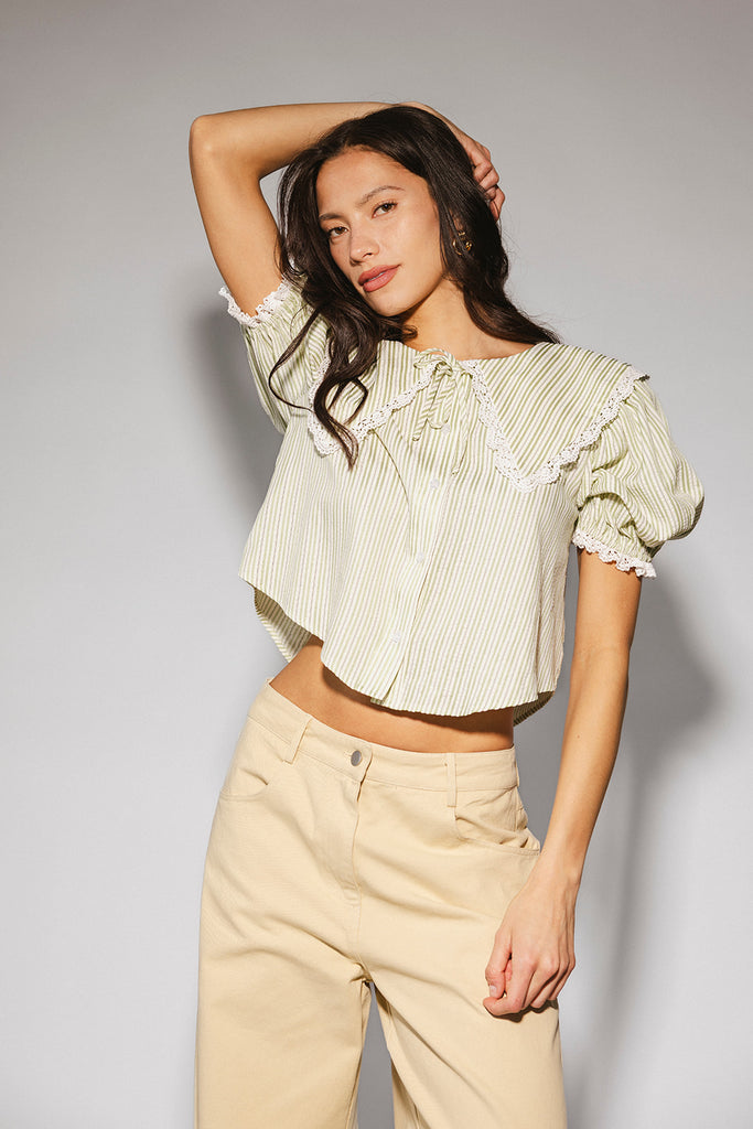 a vintage-inspired puff sleeve top with a pastel green pinstripe pattern + an oversized lace trim collar. the perfect elevated button up top for the office, dressy date nights, + everyday wear.
