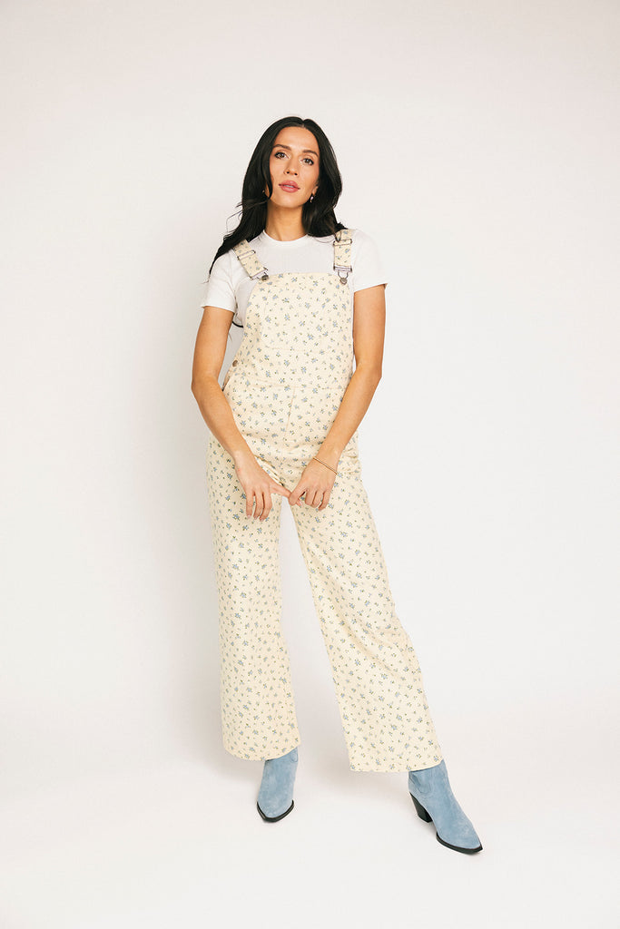 denim overalls with a ditsy blue floral pattern + straight leg fit. the perfect floral overalls for everyday wear + casual outfit styling.
