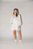 a white satin mini dress with a vintage-inspired silhouette + long balloon sleeves. the perfect little white dress for graduations, bridal showers, + fancy dinner dates.
